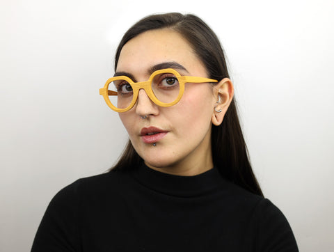 Woman wearing these luxury designer SEE Eyeglasses